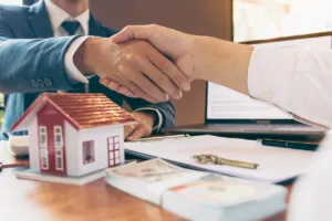 a realtor shaking hands with their client